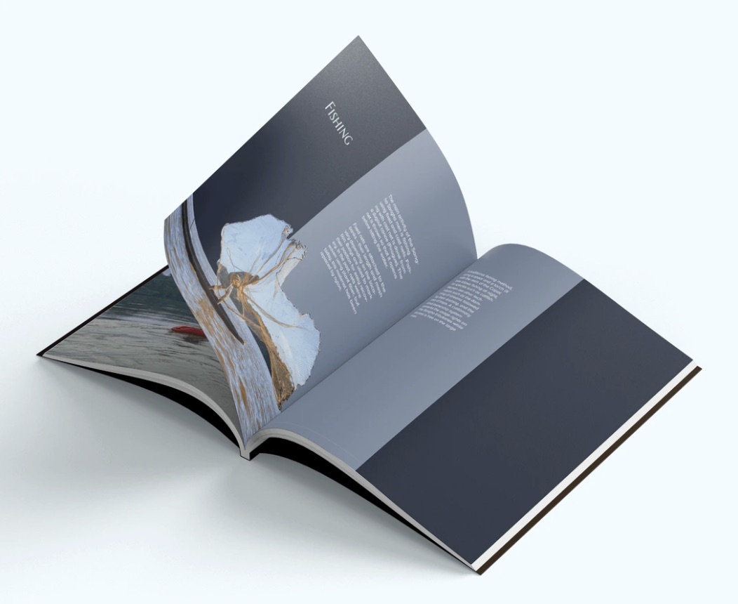 Printed mockup, the magazine open on a pale surface.